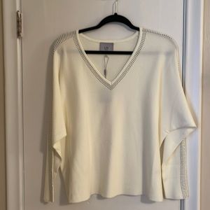 LIV NWT cotton top with studded V-neck and arms. Easy transition day to night.